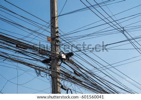Electricity poles with wires, telephone lines, internet lines. And a lot of tangle.