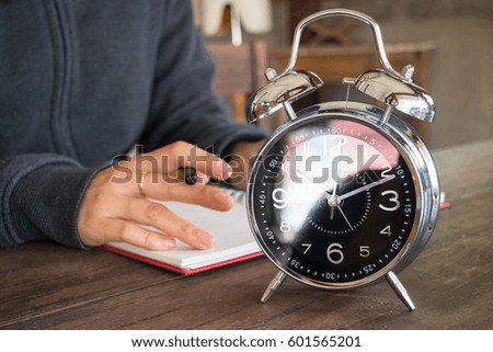 Alarm Clock On Wooden Work Table, stock photo