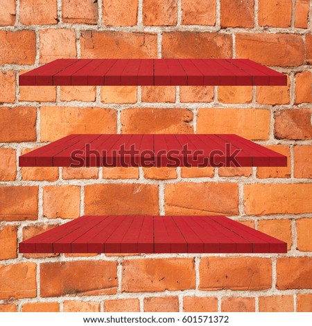 3 Red Wood Shelves Table on brick wall  background