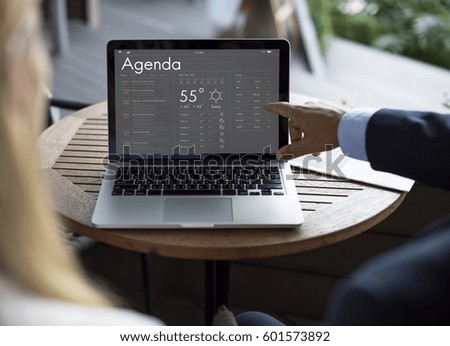 Business people checking appointment on personal organizer schedule