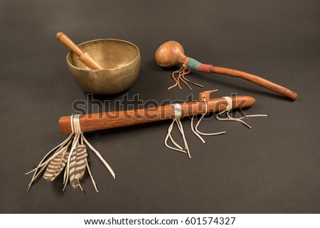 Native American Flute with Feathers and Beaded Shaker with Tibetan Singing Bowl and Ringing Stick.