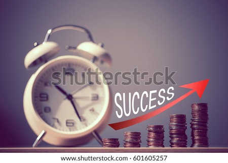 Closeup shot of clock and coins with red growth arrow. Business Finance and Money concept,Time is money.