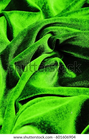 Velvet dress material cloth texture pattern. 
tailoring stitching concept. Shiny beautiful fashion fabric. Shiny clothing material sample.Creased fabric.