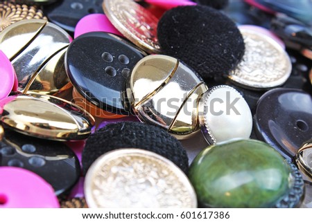 Buttons background. Colored shiny clothing button texture. Colored sewing buttons pattern concept wallpaper. Mixed colors. Studio photo texture photography.