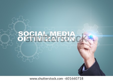 Businessman drawing on virtual screen. social media optimization concept.