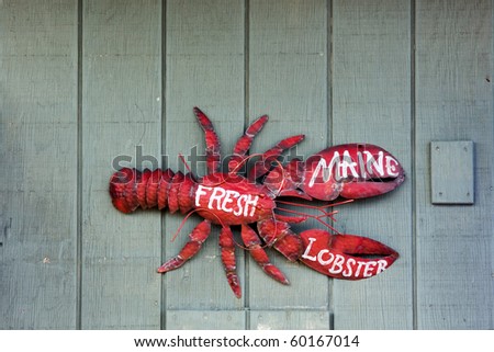 Fresh Maine lobster sign on lobster pound wall
