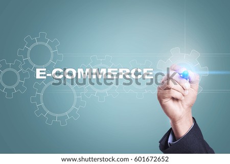 Businessman drawing on virtual screen. e-commerce concept.