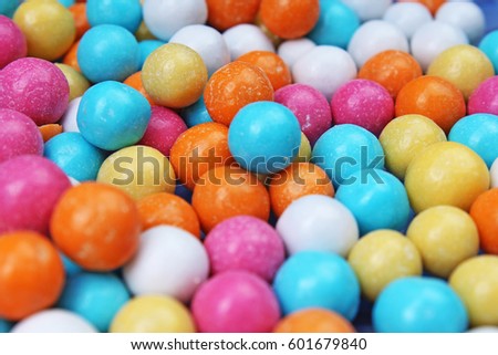 
Shiny sugar coated round chocolate balls as background. Candy bonbons multicolored texture. Round candies sweets pattern concept. Food photo studio photography. Candy background
