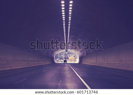 Tunnel on interstate highway 70, color toned picture, Colorado, USA.