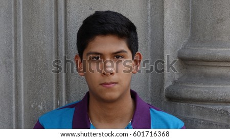 Serious Hispanic Teen Boy Royalty-Free Stock Photo #601716368