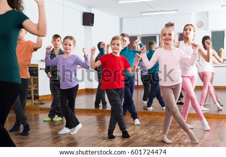 group of boys and girls studying contemp dance in studio Royalty-Free Stock Photo #601724474