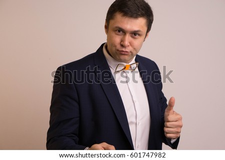 Man in jacket and shirt attractive on light background
  Presenter, toastmaster
