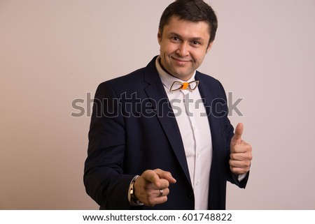 Man in jacket and shirt attractive on light background
  Presenter, toastmaster
