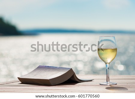 Wine and Book by the Sunny Sea