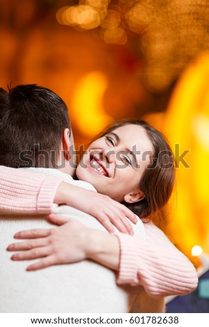Loving couple hugging in room