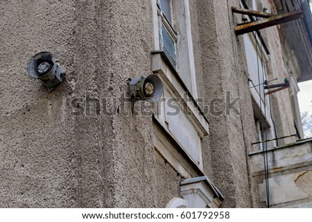 Old street loudspeakers on the wall of the house.