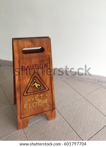 Caution wet floor wooden sign