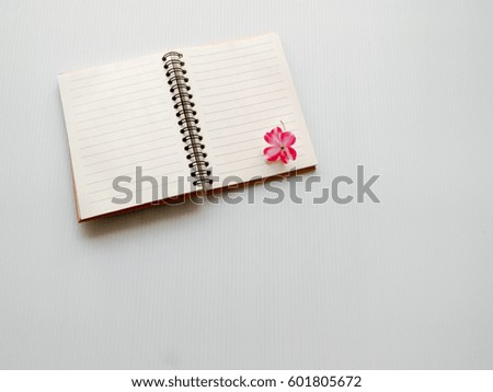diary notebook on white desk background