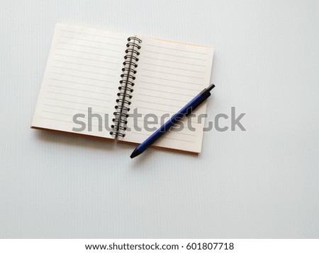 Diary notebook on white desk background