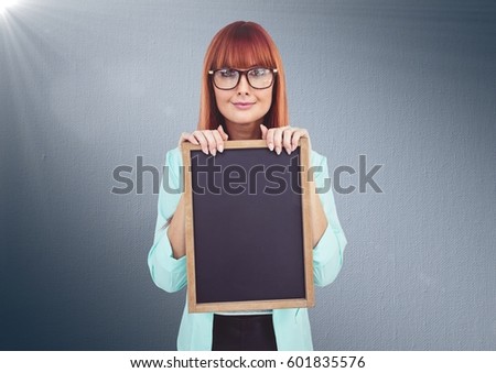 Digital composite of Woman with blackboard against navy background