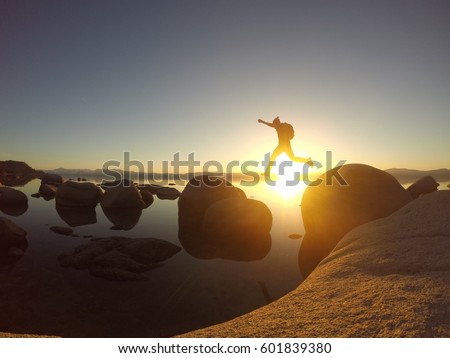 Leap of Faith on Lake Tahoe, California. Royalty-Free Stock Photo #601839380