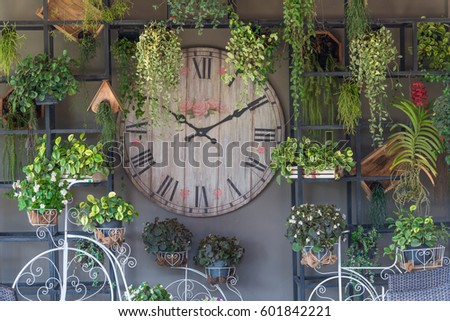Vintage clock decorated in the garden