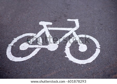 Close up bicycle symbol on the road in the park. Vintage style.