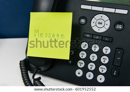 Paper note with message wording is sticked on the IP Phone