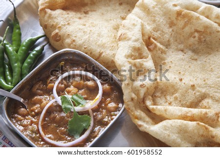 Close-up chole bhature served at table
