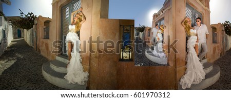young couple honeymoon on the most romantic island Santorini, Greece Royalty-Free Stock Photo #601970312