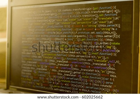 Minificated web development javascript code in sunset rays. Abstract information digital technology modern background. HTML5 concept backdrop. Screen of web developer.