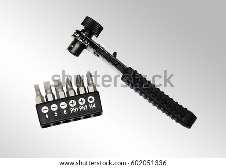 The picture of the Multi-Bit Ratcheting Screwdriver with the rubberized hand lever and set of six bits 