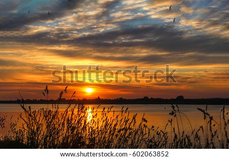 Sunset river nature cloud background Royalty-Free Stock Photo #602063852