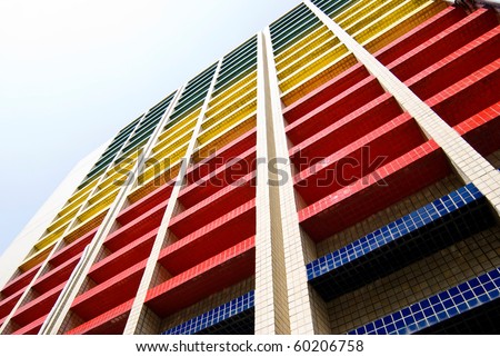 Colorful building under blue sky, office building.