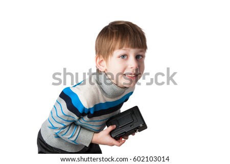 Young boy photographer taking pictures and playing with an old camera

