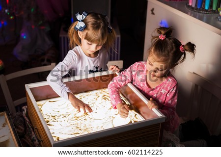 Children paint in the sand, sand animation