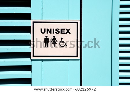 Unisex sign is posted on the outside of a public restroom door.