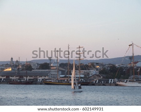 A sailboats in  a harbor. Evening