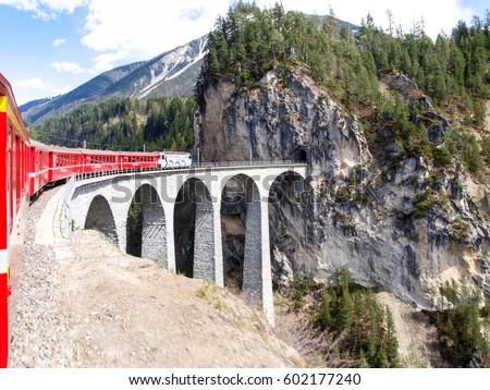 Filisur, Switzerland: The Landwasser Viaduct is a spectacular stone bridge, a 6 string.
The construction on the three main pillars was an architectural masterpiece in 1901 Royalty-Free Stock Photo #602177240