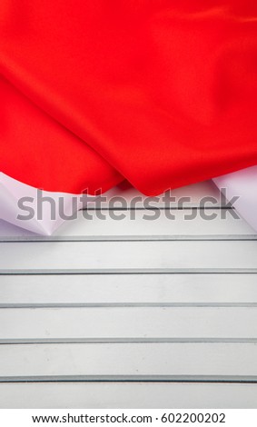 Close up view of crumpled Japan flag on wooden surface
