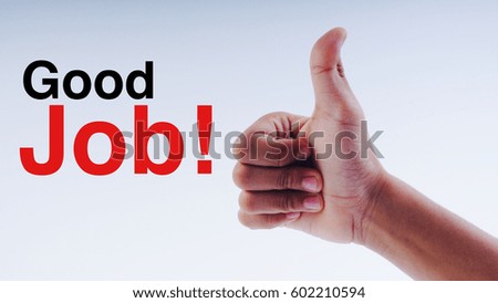 Male hand showing thumb up with word " Good Job!" on white background.Selective focus.
