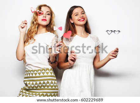life style and people concept: two stylish sexygirls best friends ready for party, over white  background