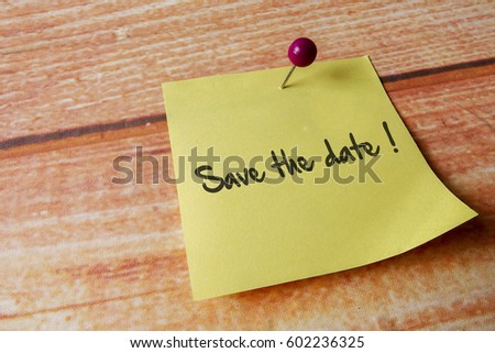 Yellow pinned note over wooden background with common message Royalty-Free Stock Photo #602236325