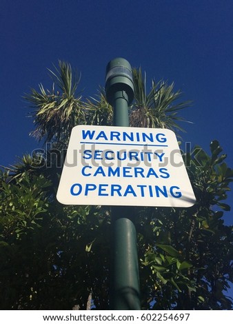Security camera road sign