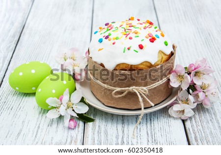 Easter bread and eggs with apple blossom  Royalty-Free Stock Photo #602350418