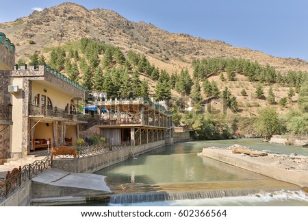 Houses standing in a valley of a mountain river