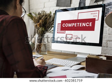 Graphic Designer Working and Using Computer on the Wooden Table
