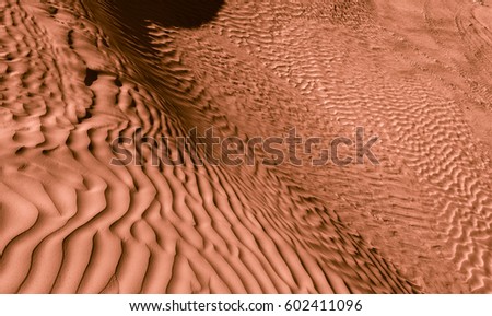 Chocolate color sands of the desert. Background and Texture