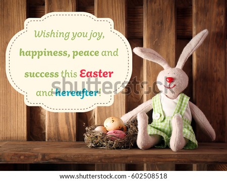 Greeting card design. Colorful Easter eggs in nest and toy bunny on wooden shelf