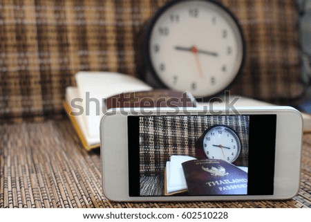Screen Capture holiday with Smart phone For Concept travel  Passport, travels, notebooks, clocks